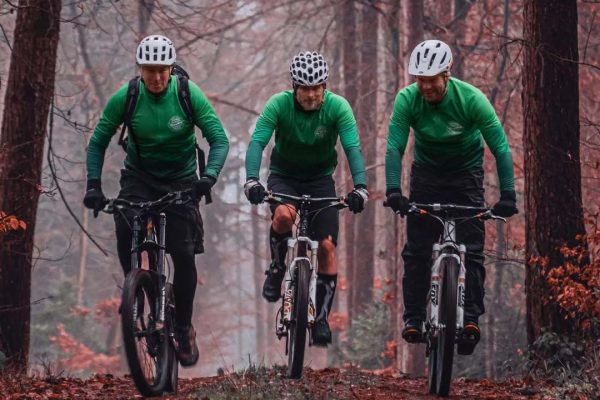 Team Greenbay Cycles riding in the woods wearing DOWE BasicForm Long-Sleeve Jerseys